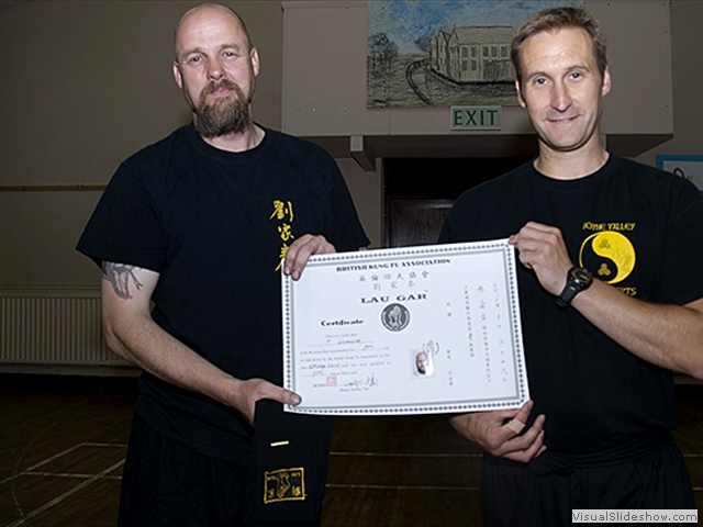Paul Granger receiving his certificate and Black Sash from Sifu Derek Dawson