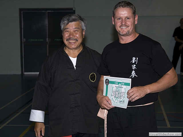 Warrick Bowler receiving his Green Sash from Master Yau at the Summer Course