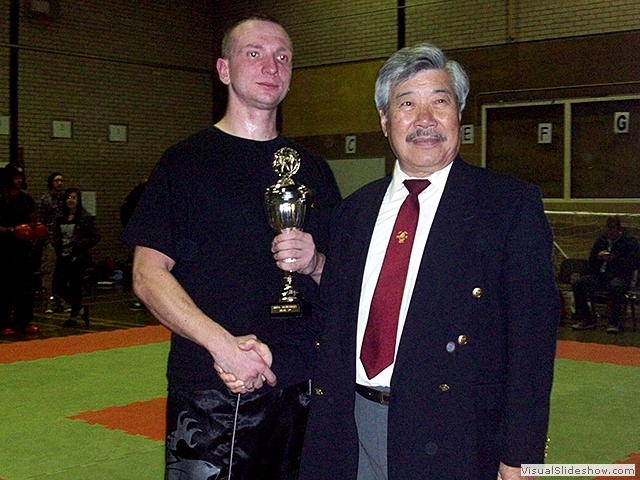 Arik receiving his trophy from Master Yau at the BKFA Nationals