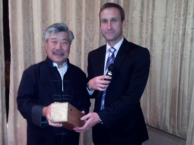 Sifu Derek Dawson presenting Master Yau with a rare gift