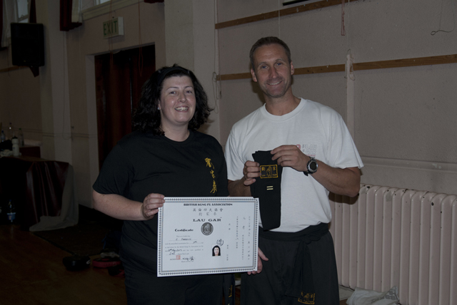 Catriona receiving her Second Degree Black Sash from Sifu Derek Dawson