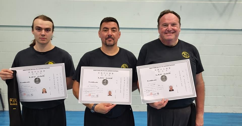 Dawid Szewzyk, Paul Tunnicliffe and Sean Collard with their Black Sashes and Certificates at the Summer Course.